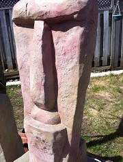 red brown granite garden statue